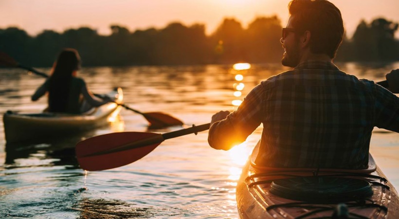 a man and a woman kayaking
