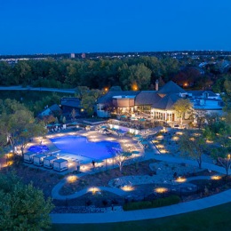 an aerial view of an apartment complex with a pool