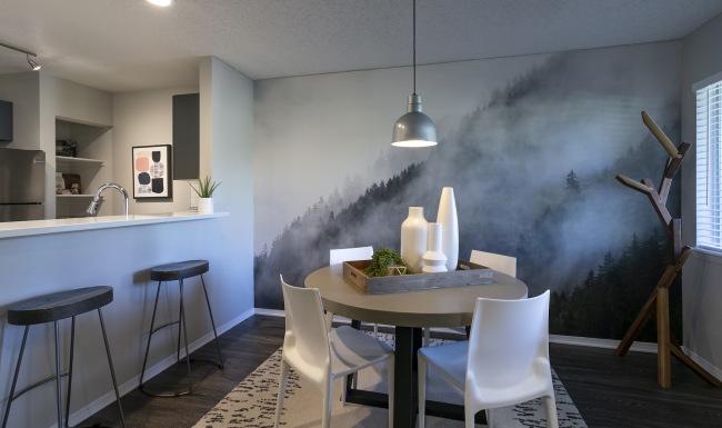 a dining room with a table and chairs