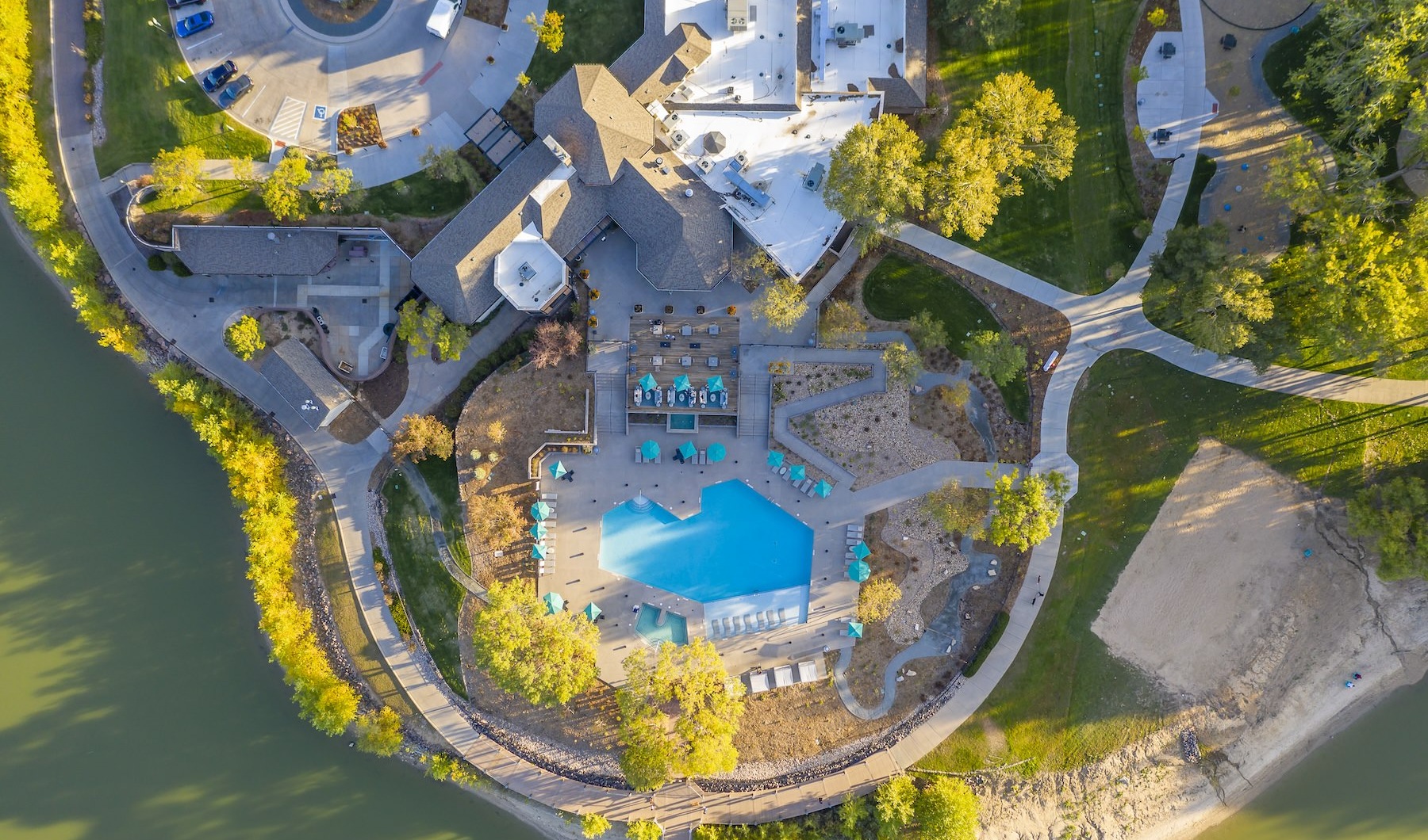 a drop down view of an apartment complex with a pool